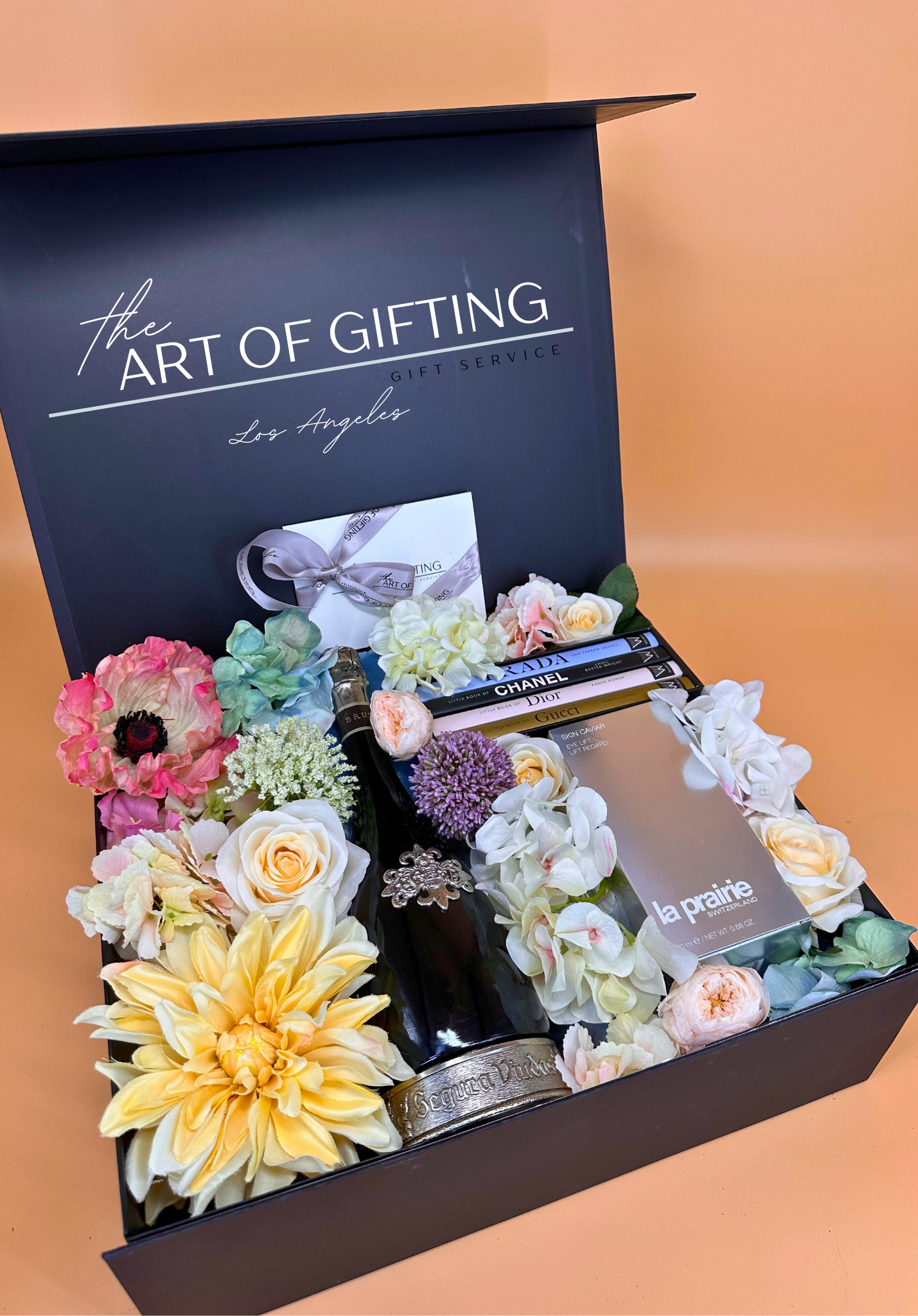 The Art of Gifting gift set for women with la praire serum, fresh lowers and STYLE set of books