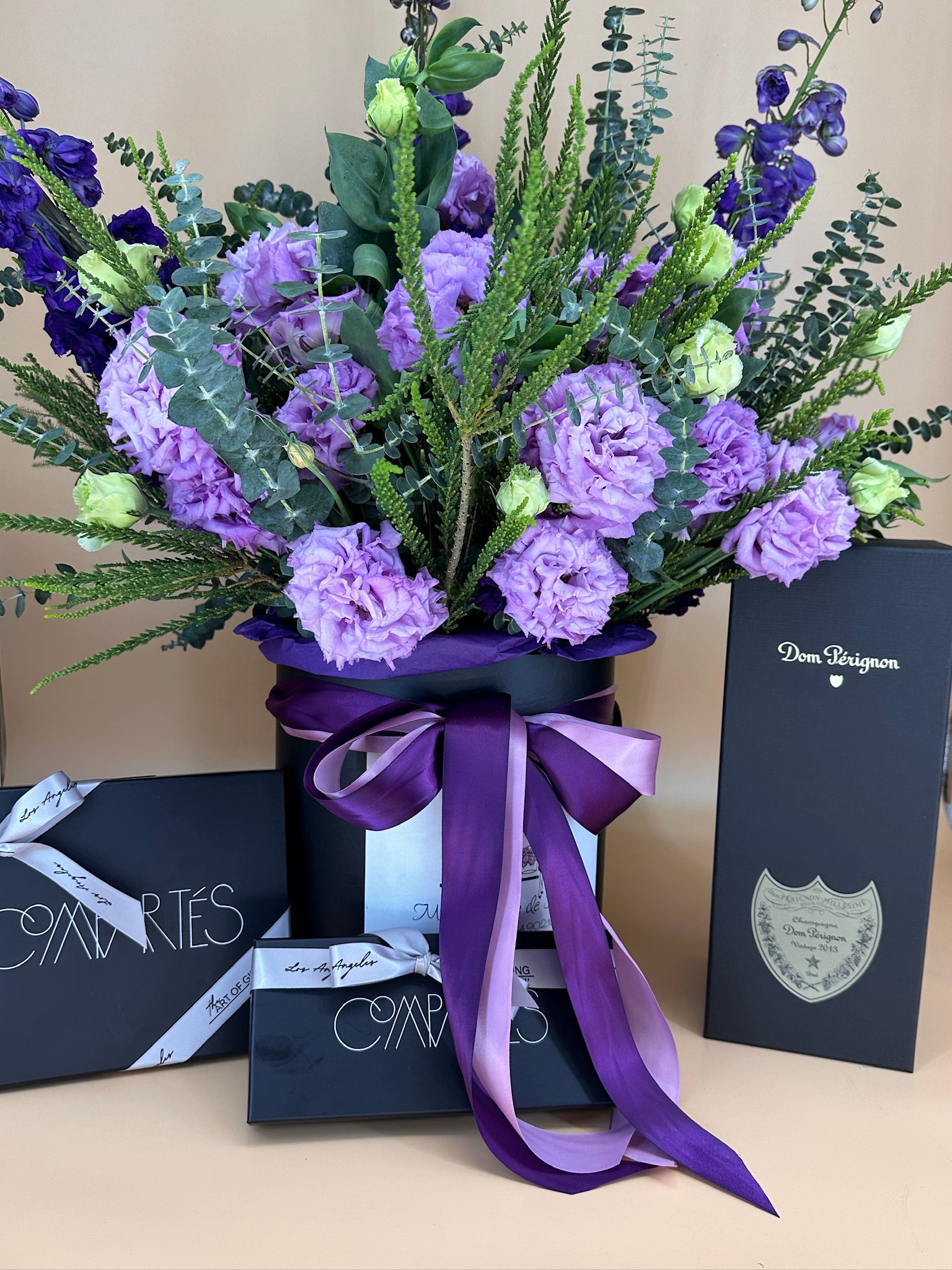 Purple-green fresh flowers with chocolate and Dom Perignon.