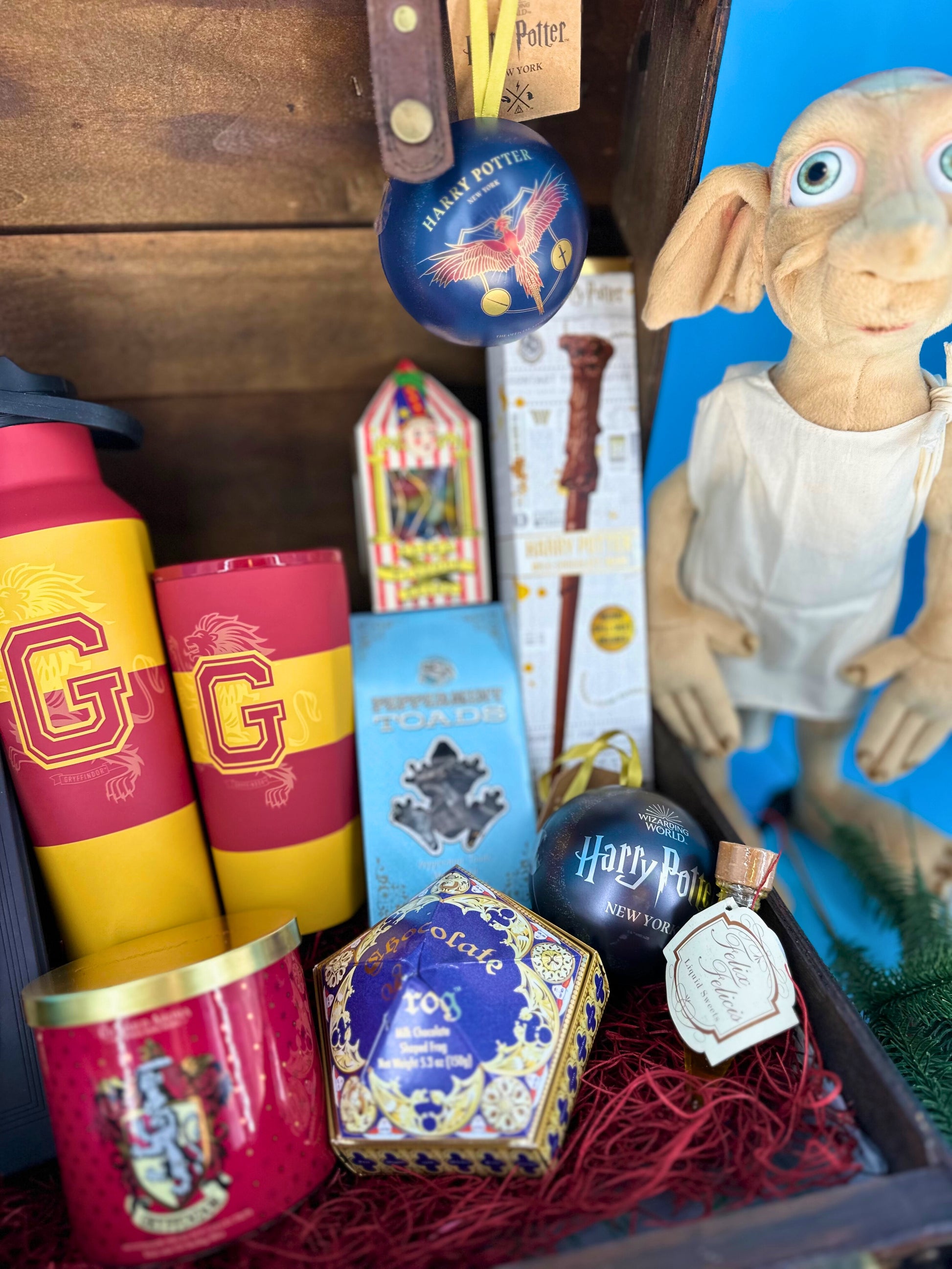 Gift for Harry Potter fans lovers. Harry Potter suitcase with Gryffindor Corkcircle sport bottle and thumbler, Dobby toy and chocolate wand.