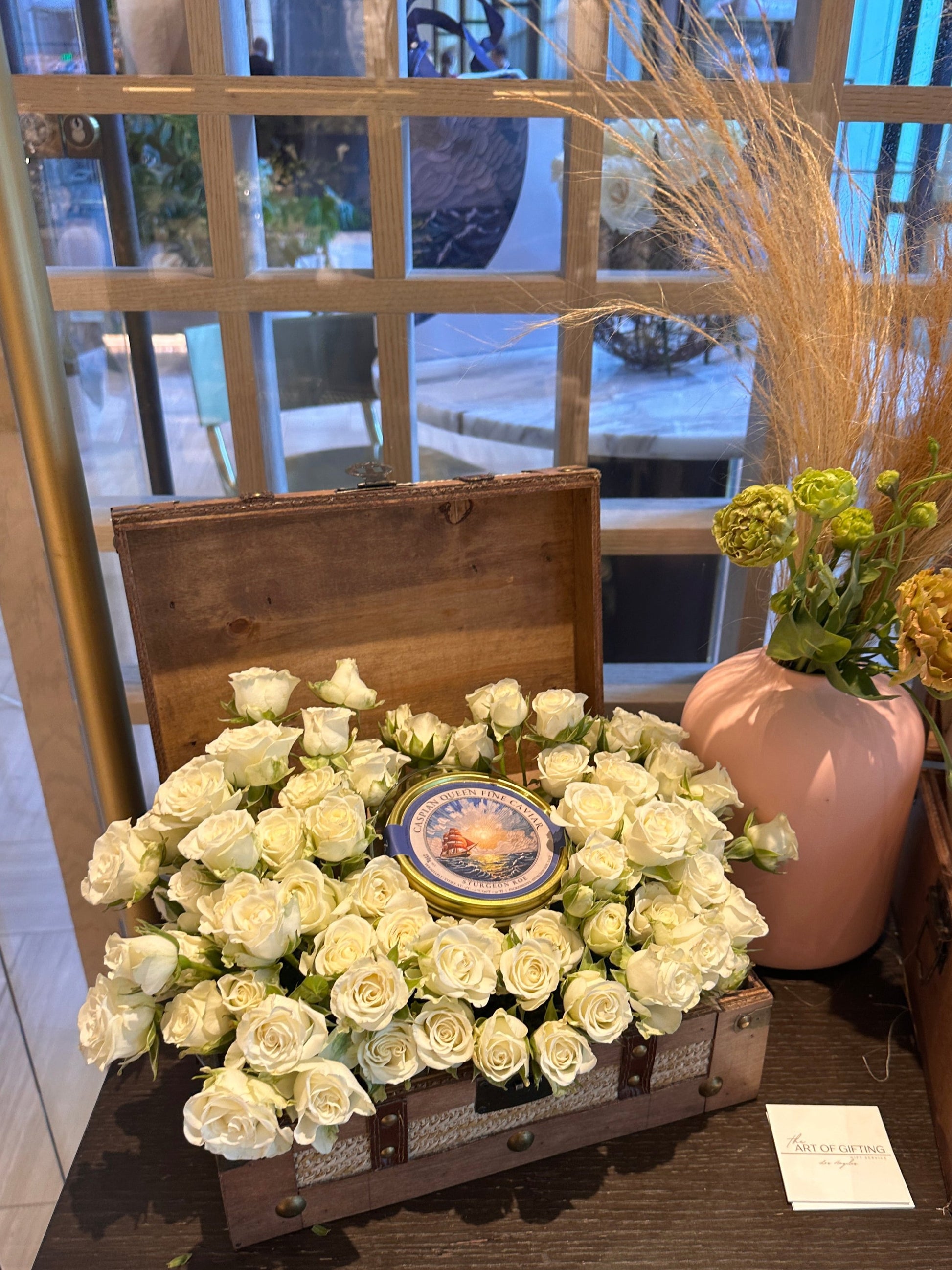 Wooden keepsake with flowers and black caviar