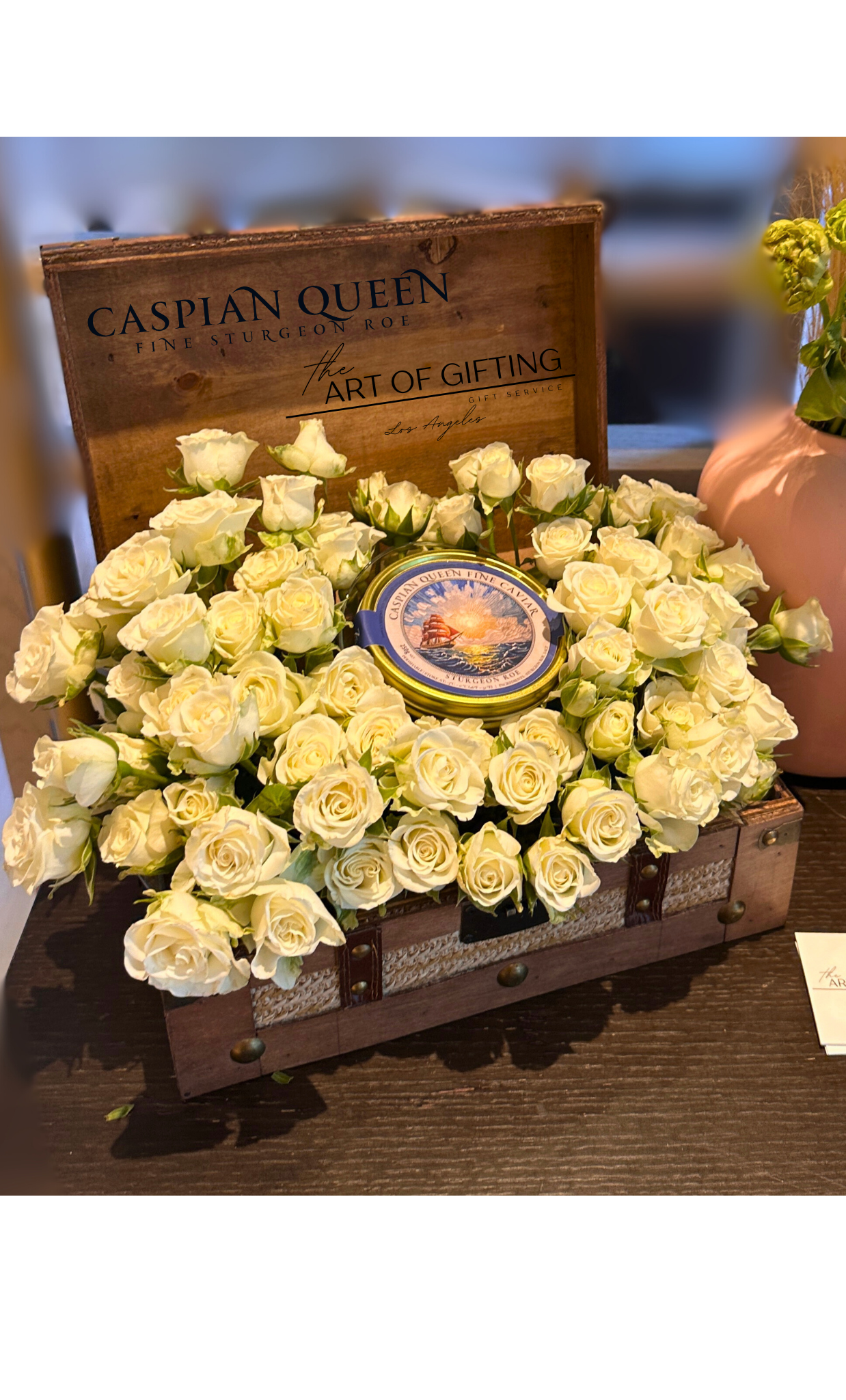 Wooden keepsake full of fresh flowers and black caviar